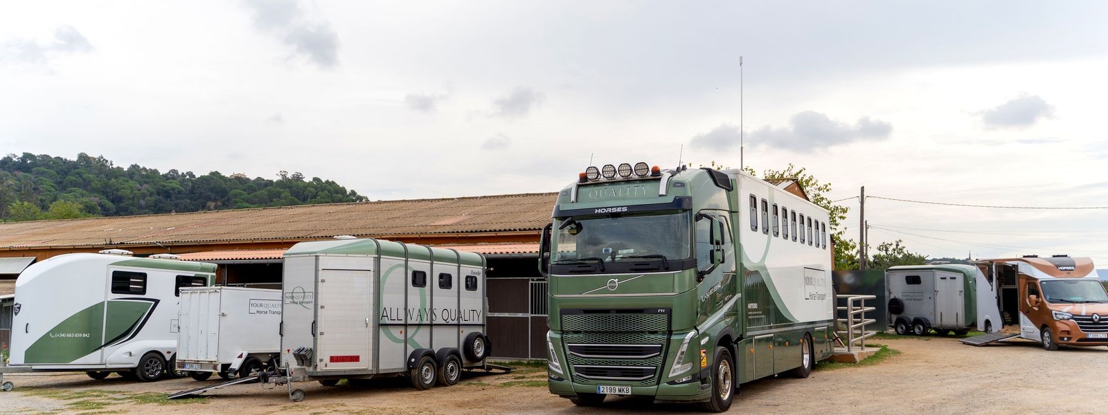 The YQHT fleet of lorries, vans and trailers lined up at the base